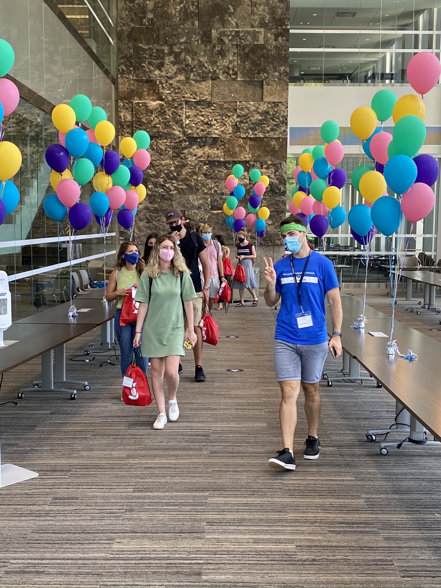 Students walking through Tory's Hall during Orientation